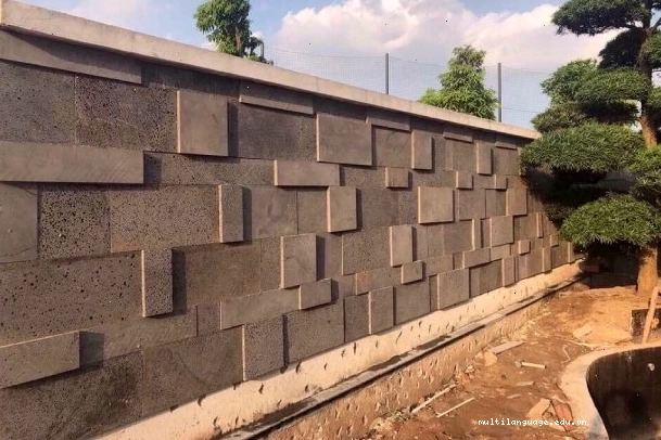 Đá ong xám ốp tường với gam màu trầm ấm