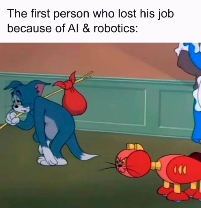Tom buồn bã với túi đồ, theo sau là một chú mèo robot đỏ, minh họa sự thay thế công việc bởi AI
